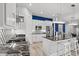 Contemporary kitchen with stainless steel appliances, black countertops, white cabinets, and a stylish backsplash at 125 Harbor Oaks Dr., Myrtle Beach, SC 29588