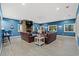 Spacious living room featuring blue walls, modern furnishings, and plenty of natural light at 125 Harbor Oaks Dr., Myrtle Beach, SC 29588