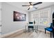 Bright office space with a modern white desk, comfortable chairs, large world map and natural light at 125 Harbor Oaks Dr., Myrtle Beach, SC 29588
