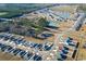An aerial view shows a new development with a pond, neat streets, and a cul-de-sac in a serene environment at 127 Clover Walk Dr., Conway, SC 29526