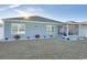 Backyard features a screened porch, landscaping and pristine lawn at 127 Clover Walk Dr., Conway, SC 29526