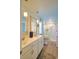 Bright bathroom featuring a double sink vanity, framed mirrors, and a walk in shower at 127 Clover Walk Dr., Conway, SC 29526