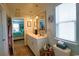 Bright bathroom featuring a double sink vanity, framed mirrors, and a view into the bedroom at 127 Clover Walk Dr., Conway, SC 29526