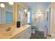 Bright bathroom featuring a double sink vanity, framed mirrors, and a walk in shower at 127 Clover Walk Dr., Conway, SC 29526