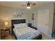 Comfortable bedroom featuring coastal decor, a ceiling fan, and a bench with a blue pillow at 127 Clover Walk Dr., Conway, SC 29526