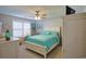 Relaxing bedroom featuring a ceiling fan, bright windows, and a queen sized bed at 127 Clover Walk Dr., Conway, SC 29526