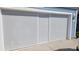 A garage with a white privacy screen for added privacy at 127 Clover Walk Dr., Conway, SC 29526