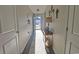 Inviting hallway with hardwood floors and neutral walls, illuminated by natural light and modern light fixtures at 127 Clover Walk Dr., Conway, SC 29526