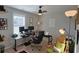 Functional home office featuring a large desk, comfortable chair, and ample natural light at 127 Clover Walk Dr., Conway, SC 29526