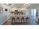 Modern kitchen with a large island, granite countertops, white cabinets, and stainless steel appliances at 127 Clover Walk Dr., Conway, SC 29526