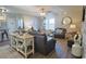 Cozy living room featuring hardwood floors, ceiling fan, and comfortable seating arrangements at 127 Clover Walk Dr., Conway, SC 29526
