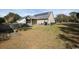 A large backyard with a screened in porch and a view of the surrounding neighborhood at 13 Daniel Morrall Ln., Georgetown, SC 29440