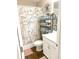 Quaint bathroom with nautical décor and well-organized storage shelves at 13 Daniel Morrall Ln., Georgetown, SC 29440