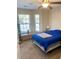 Cozy bedroom with natural light from windows and a comfortable blue bed at 13 Daniel Morrall Ln., Georgetown, SC 29440