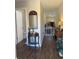 A home hallway featuring wood floors, decorative furniture, and views into the living area at 13 Daniel Morrall Ln., Georgetown, SC 29440