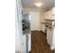 Efficient kitchen with white cabinetry, granite countertops, and stainless steel appliances, featuring wood floors at 13 Daniel Morrall Ln., Georgetown, SC 29440