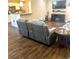 Inviting living room area with modern furnishings and wood floors, connected to the kitchen at 13 Daniel Morrall Ln., Georgetown, SC 29440