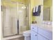 Bright bathroom features a glass-enclosed shower, white vanity with counter space and matching decor at 135 Butkus Dr. # 5, Myrtle Beach, SC 29588