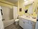 Traditional bathroom featuring a shower-tub combination, classic vanity, and a decorative mirror at 135 Butkus Dr. # 5, Myrtle Beach, SC 29588