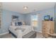 Bedroom with hardwood flooring, neutral paint, and an abundance of natural light at 135 Butkus Dr. # 5, Myrtle Beach, SC 29588