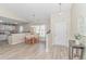 An open dining area featuring a round table, wood floors and connection to the kitchen at 135 Butkus Dr. # 5, Myrtle Beach, SC 29588
