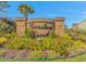 Stone entrance sign for Garden Creek surrounded by bright flowers and greenery at 135 Butkus Dr. # 5, Myrtle Beach, SC 29588