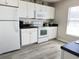 Well-lit kitchen featuring white cabinets, modern appliances, and a convenient layout at 135 Butkus Dr. # 5, Myrtle Beach, SC 29588