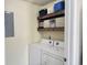 Laundry room with washer, dryer, and rustic shelves and decorations at 135 Butkus Dr. # 5, Myrtle Beach, SC 29588