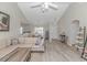 Spacious living room featuring wood floors, and an open layout connecting the kitchen and dining area at 135 Butkus Dr. # 5, Myrtle Beach, SC 29588