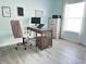 Home office features modern desk, ergonomic chair, a light color palette, and wood floors at 135 Butkus Dr. # 5, Myrtle Beach, SC 29588