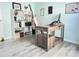 Home office features modern desk, ergonomic chair, a light color palette, and wood floors at 135 Butkus Dr. # 5, Myrtle Beach, SC 29588