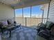 Screened porch with seating area, ceiling fan, view of the property and neighborhood at 135 Butkus Dr. # 5, Myrtle Beach, SC 29588