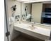 Well lit bathroom with integrated sink and large mirror at 1501 S Ocean Blvd. # 1546, Myrtle Beach, SC 29577