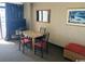 Dining area with a table and chairs, next to sliding doors leading to a balcony at 1501 S Ocean Blvd. # 1546, Myrtle Beach, SC 29577