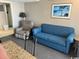 Inviting living area featuring a blue sofa and recliner for relaxing, with natural light at 1501 S Ocean Blvd. # 1546, Myrtle Beach, SC 29577