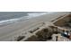 An aerial view of the beach, boardwalk and a partial view of the community pool area at 1501 S Ocean Blvd. # 935, Myrtle Beach, SC 29577