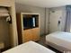 Cozy hotel room with television in cabinet with door that open to reveal a spacious, well lit room at 1501 S Ocean Blvd. # 935, Myrtle Beach, SC 29577