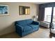 Comfortable living space with sofa, tropical artwork, and a balcony view at 1501 S Ocean Blvd. # 935, Myrtle Beach, SC 29577