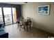 Cozy condo living area with dining table, balcony access and pleasant decor at 1501 S Ocean Blvd. # 935, Myrtle Beach, SC 29577