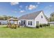 Spacious backyard with manicured lawn, a pergola-covered outdoor seating area, and a well maintained lawn at 172 Board Landing Circle, Conway, SC 29526