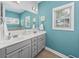 Bathroom features a double vanity with storage and a bright window with natural light at 172 Board Landing Circle, Conway, SC 29526