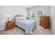 Cozy bedroom featuring a queen-sized bed, natural light, and classic furnishings at 172 Board Landing Circle, Conway, SC 29526