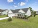 Beautiful single-story home with manicured lawn, landscaping and an attached two car garage at 172 Board Landing Circle, Conway, SC 29526