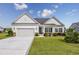 Charming single-story home with a manicured lawn, attached garage, and inviting blue front door at 172 Board Landing Circle, Conway, SC 29526