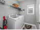 Practical laundry room with modern appliances and storage shelving at 172 Board Landing Circle, Conway, SC 29526