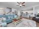 Open-concept living room flows seamlessly into the modern kitchen with an island and barstool seating at 172 Board Landing Circle, Conway, SC 29526