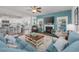 Bright living room features a fireplace, ceiling fan, and flows into the modern kitchen with breakfast bar at 172 Board Landing Circle, Conway, SC 29526