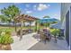 Outdoor living space includes a pergola-covered patio with a dining set, lounge chairs, and grill at 172 Board Landing Circle, Conway, SC 29526