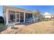 Backyard patio with outdoor seating and screened-in porch, perfect for relaxing and entertaining at 1878 Heritage Loop, Myrtle Beach, SC 29577