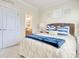 Bright bedroom featuring a comfortable queen bed with an inviting bathroom visible through the doorway at 1878 Heritage Loop, Myrtle Beach, SC 29577